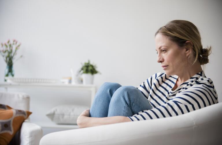 concerned woman sitting in chair