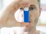 man-using-inhaler
