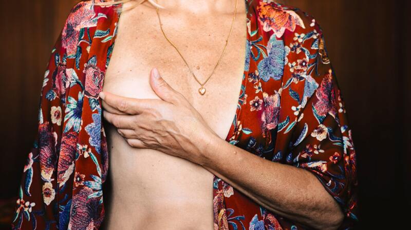 Female covering one breast