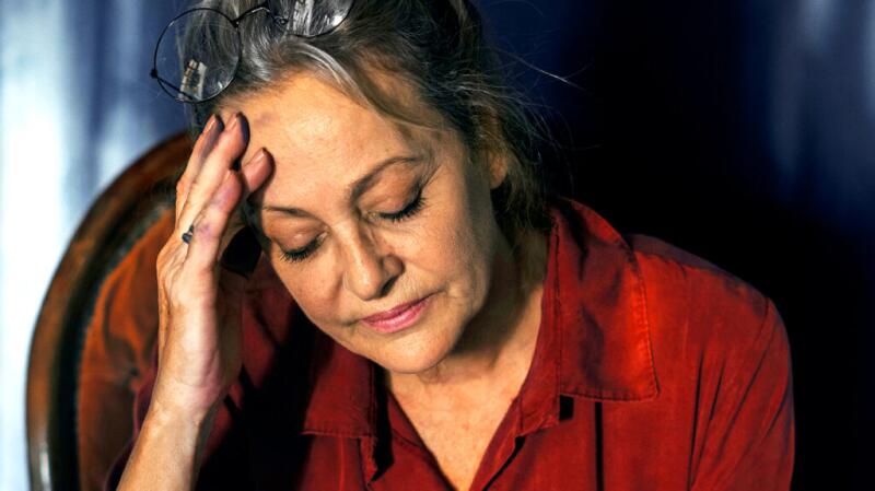 Female with her hand on her forehead