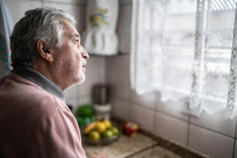 Contemplative senior man at home