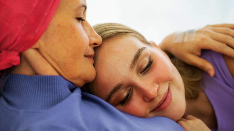 Daughter lying on her mother