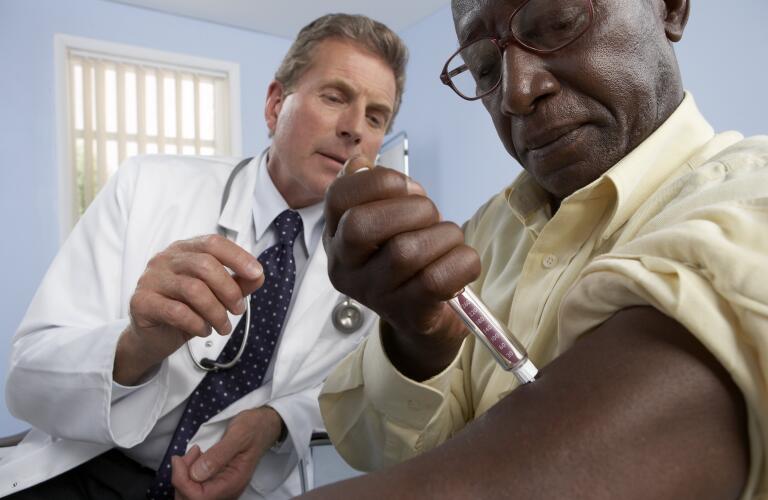 doctor-helping-man-inject-diabetes-medication