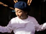A Japanese active senior woman performs street-style dance in dance studio and street.