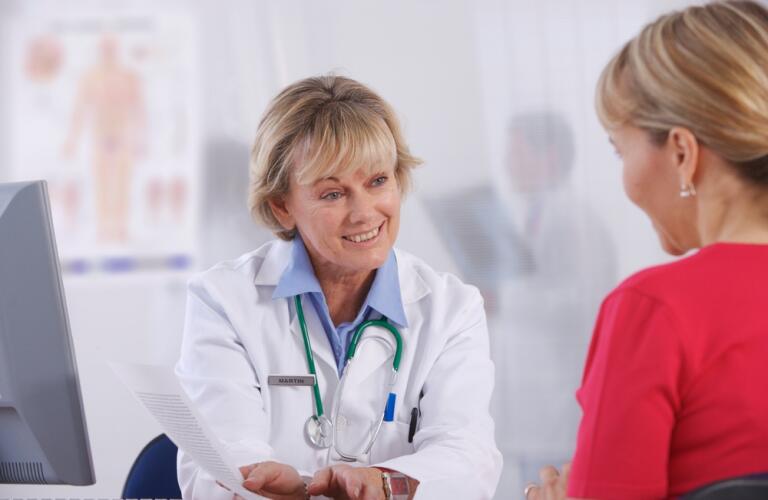 Woman Doctor Talking to Woman Patient
