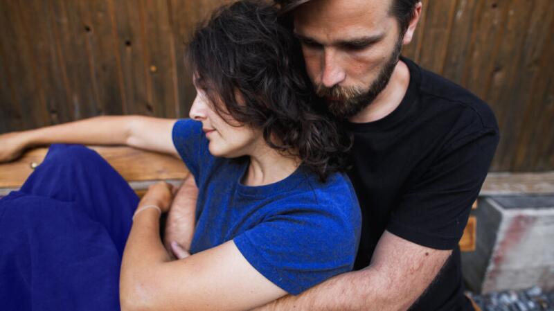 a couple are embracing