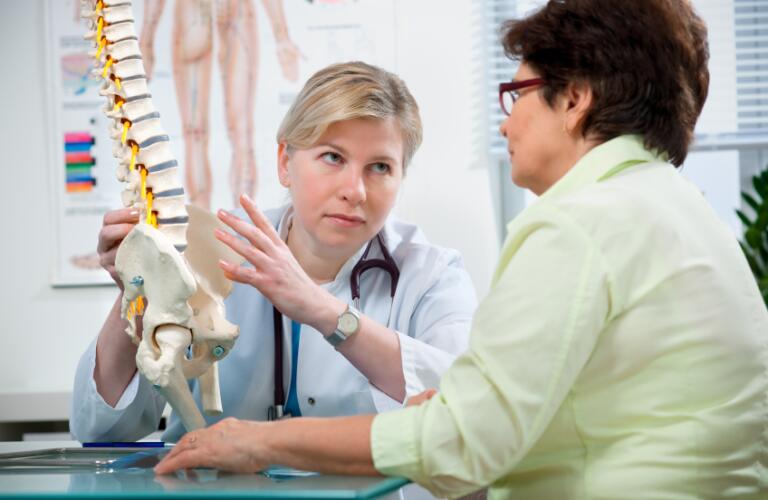 doctor and patient looking at a model