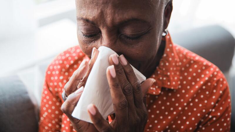 Person blowing their nose