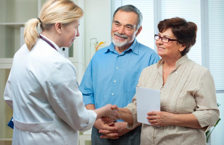 Female doctor talking with a couple