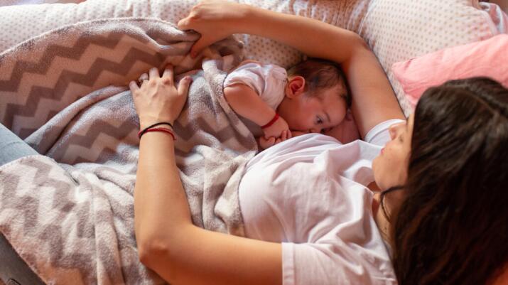 A baby breastfeeds