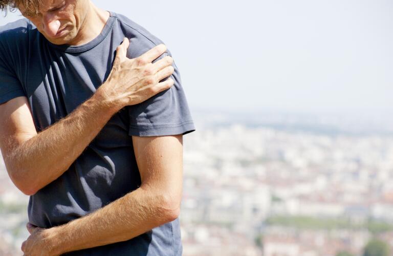 Man feels heartache suffering from cardio ailments and clutching