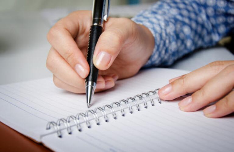 Man writing in journal