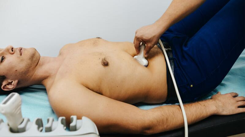 man having abdominal ultrasound