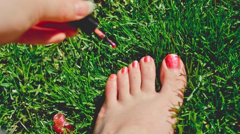 A person painting their toenails