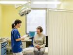 female doctor with female patient in hospital room