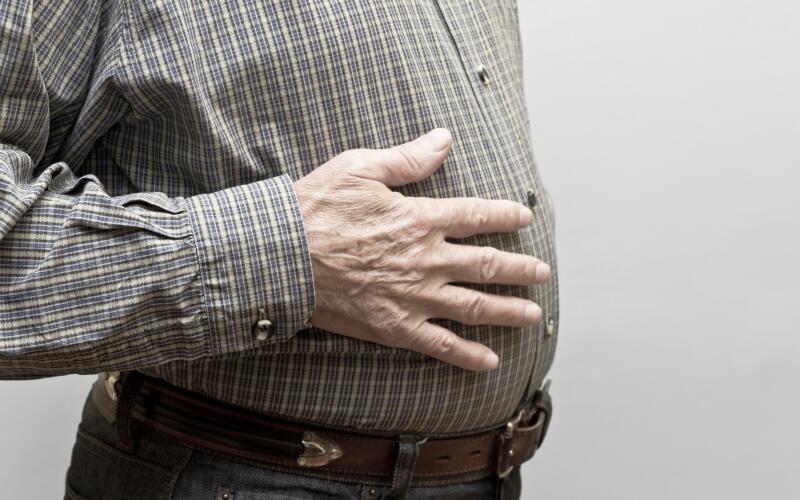 man-touching-stomach
