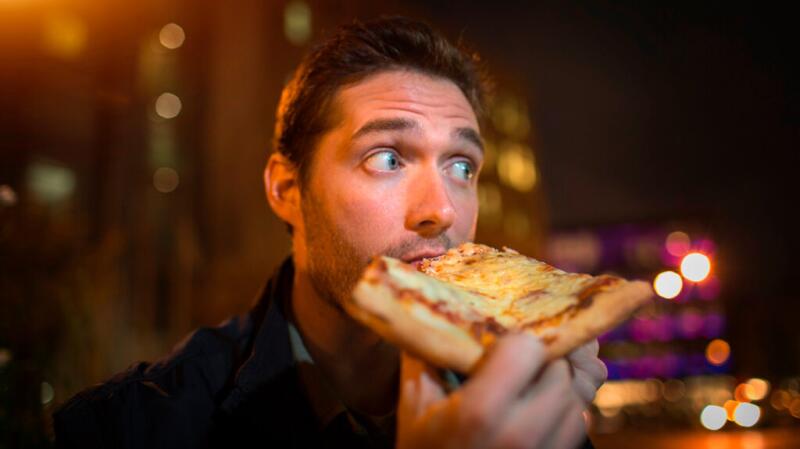 Man eating pizza