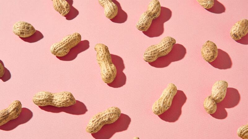 Peanuts on a pink background
