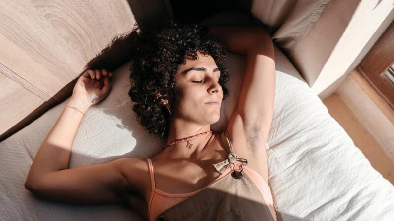 A woman sleeping in her bed