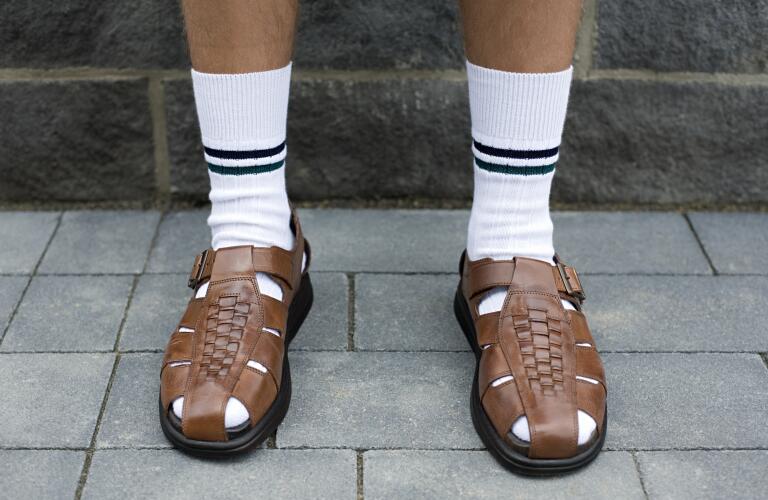 unidentified man wearing white crew socks with sandals