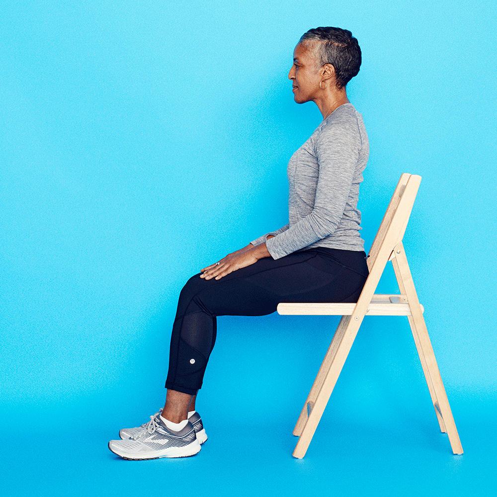 a person is performing a seated rotational stretch