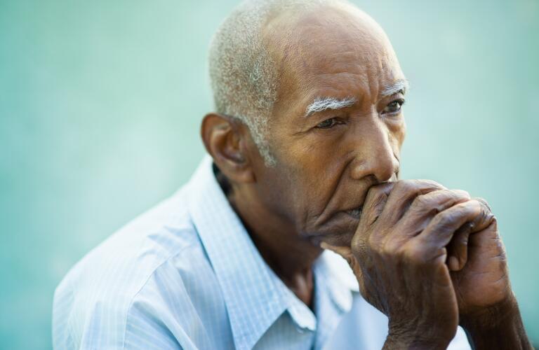 serious senior male in comtemplation