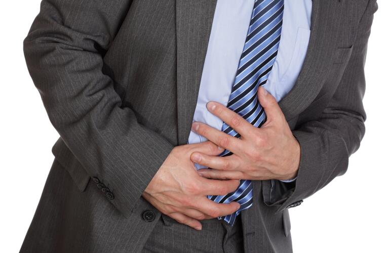 man holding stomach