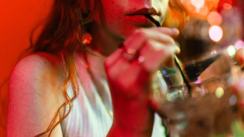 A woman drinking alcohol