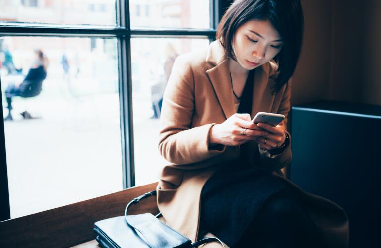 young woman looking at smartphone