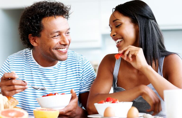 young couple eating fruit