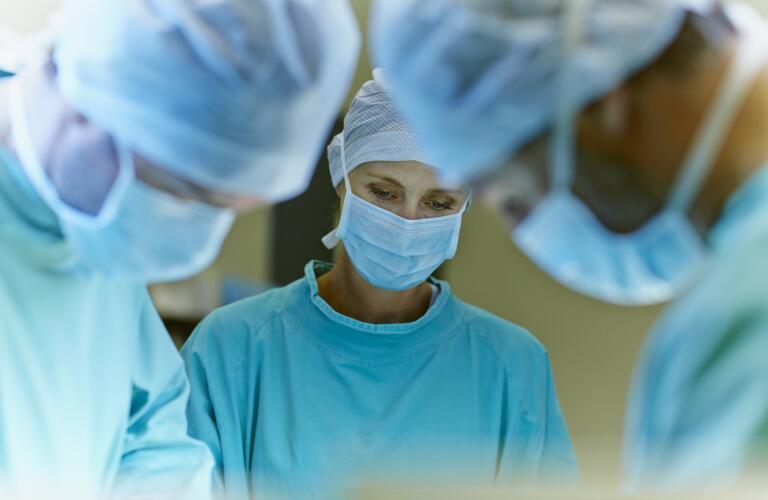 Team of surgeons in operation room
