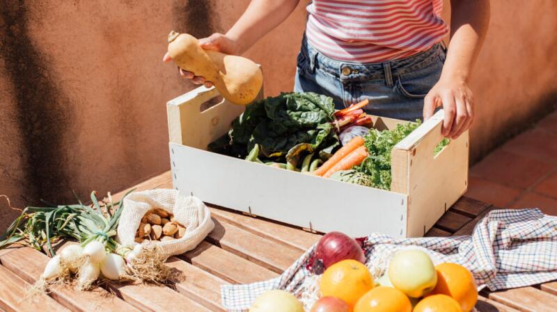 hg-woman-with-produce-box-1296x728-header-1024x575.jpg