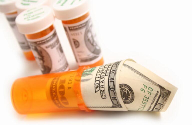 pill bottle with money in it
