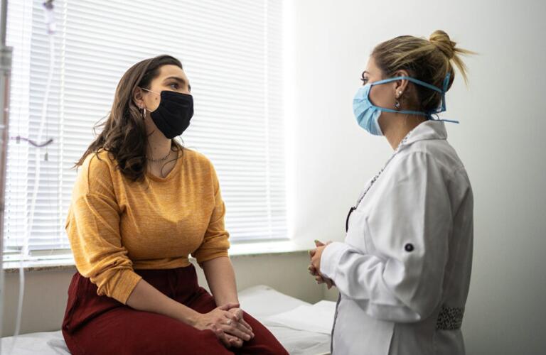 a person with endometrial hyperplasia is talking to a doctor