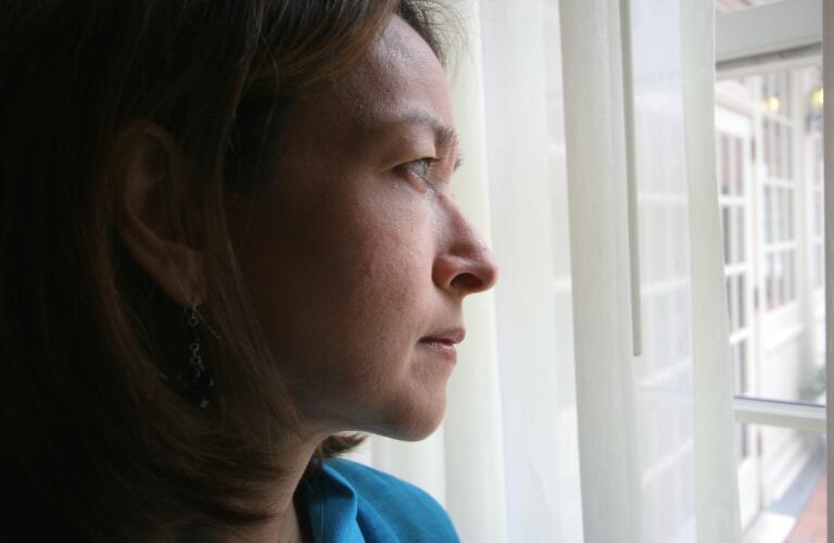 woman look though window