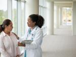 doctor talking to female patient