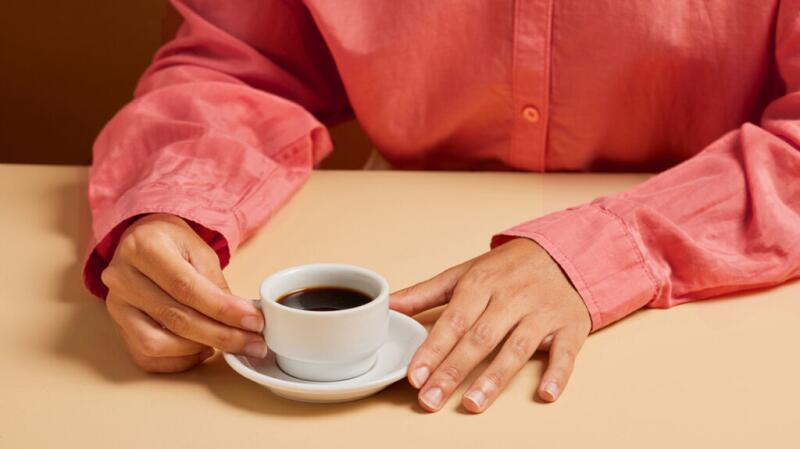 A person drinking coffee