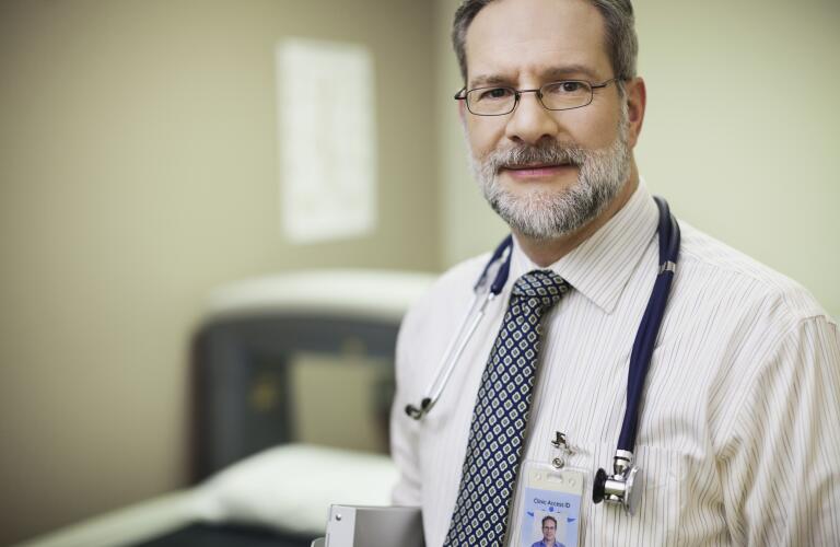 doctor-with-stethoscope-looking-at-camera
