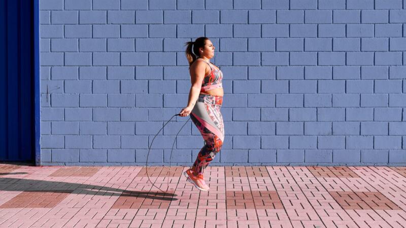 A woman jumping rope outside