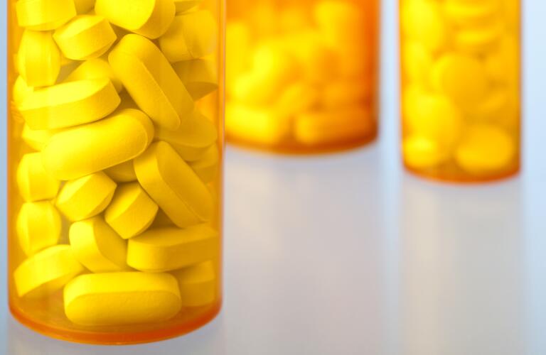 Close-Up of Prescription Medicine Bottles Containing Pills and Tablets
