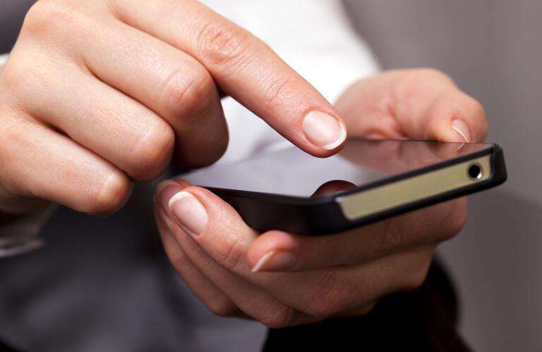 woman scrolling through phone