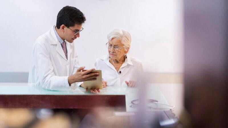 Older woman consulting with a doctor