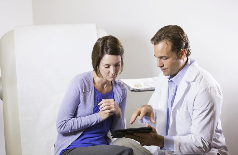 female patient looking at results with doctor