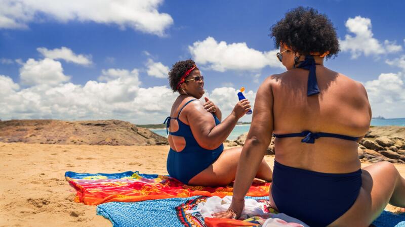 Women applying sunscreen