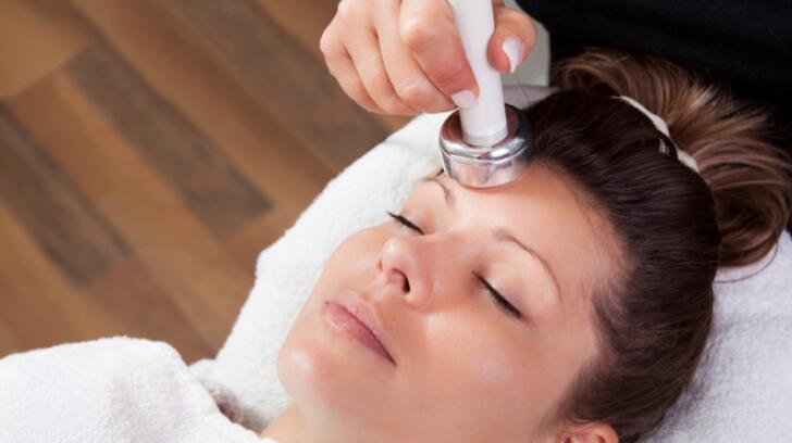 Young Woman Getting Laser Skin Treatment