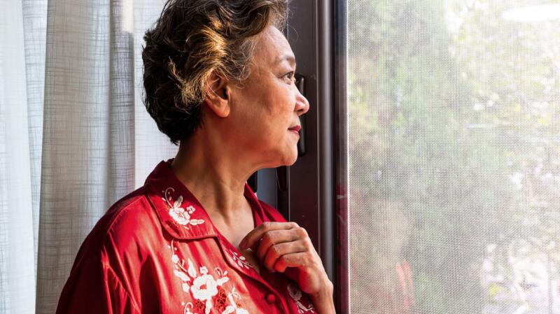 A woman is looking out of the window