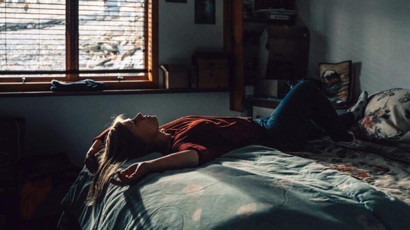 woman laying on bed