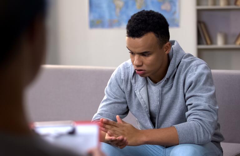 African american (black) male teenager in a counseling session 