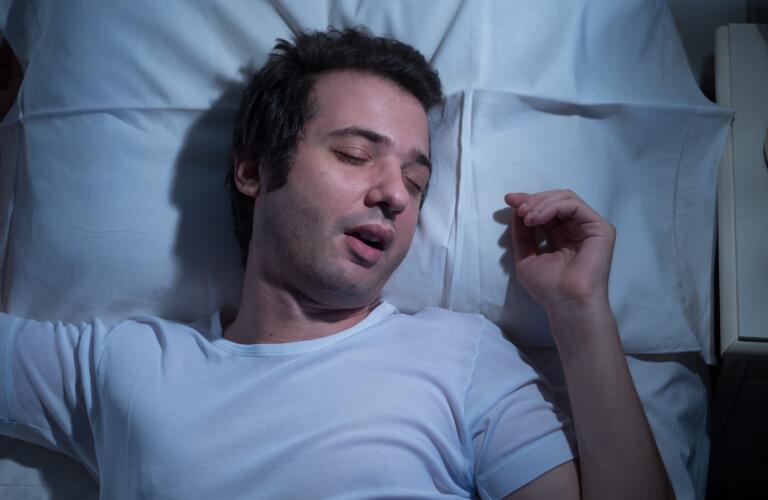 man sleeping with mouth open