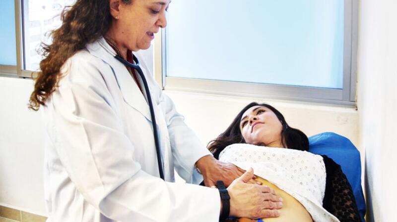 Female being checked by a doctor